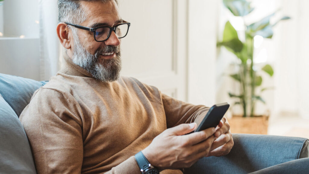 smiling health man using baseline health test results by my labs direct at home health tesing