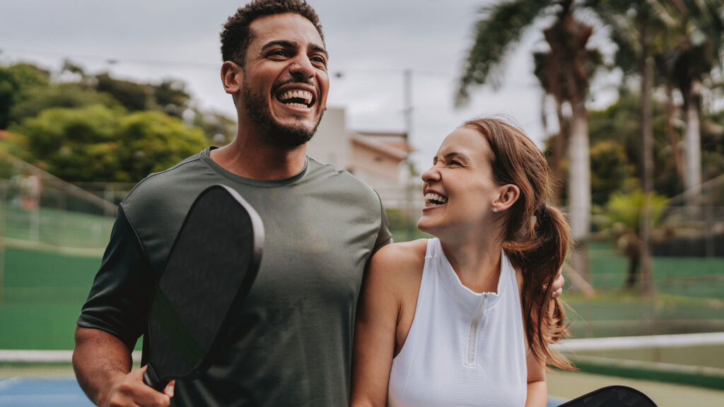 healthy man and woman smiling playing pickleball for my labs direct testosterone at home testing article